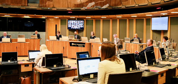 Members of the Senedd sat in the Debating Chamber of the Senedd Building